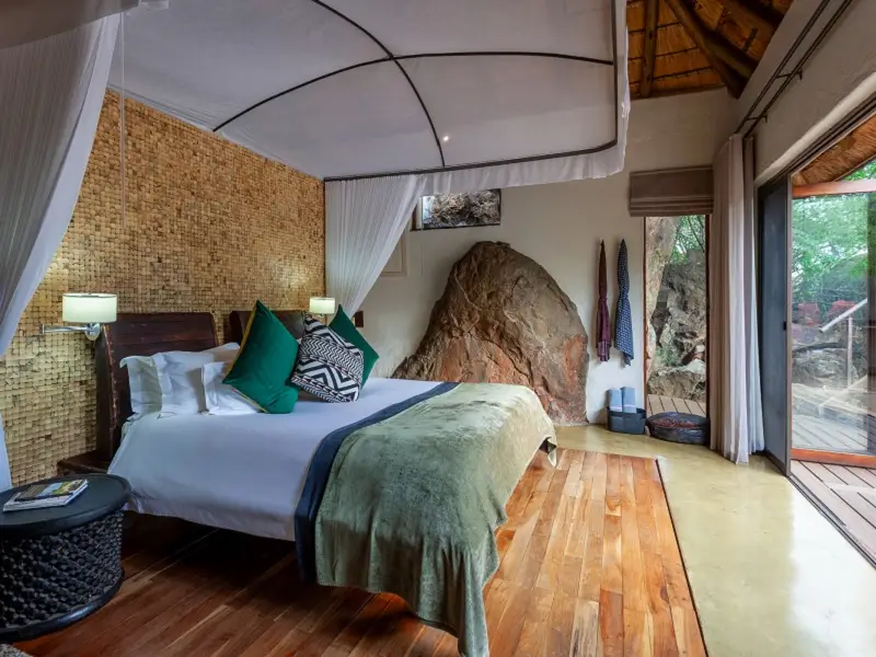 Luxury suite bed at Madikwe Hills