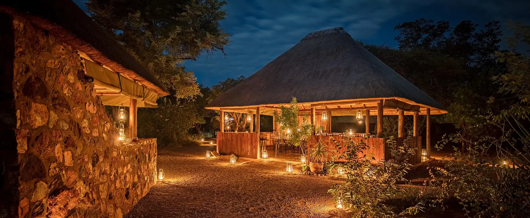 Lanterns shining around the lodge main area and huests units at Mosethla Eco Lodge