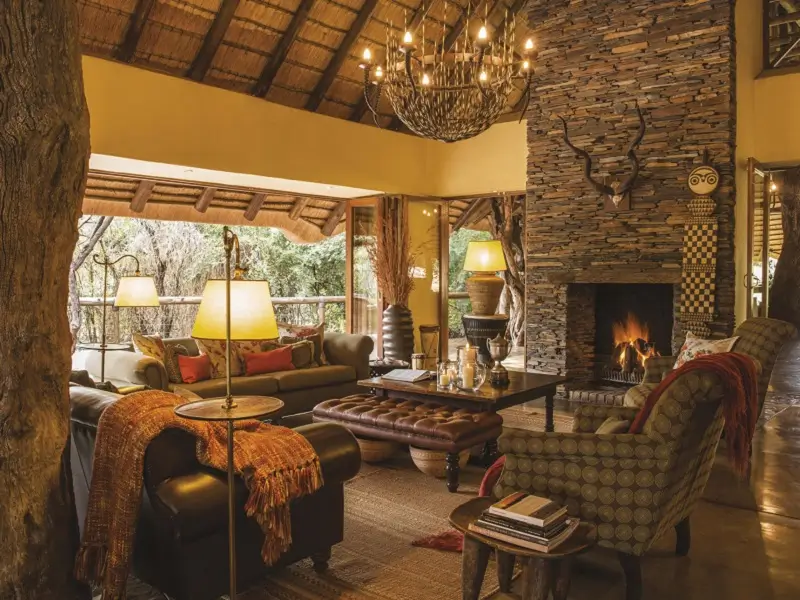Lounge and fireplace at Tuningi Safari Lodge